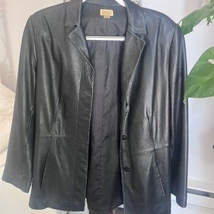 Large vintage women’s cast on leather jacket. 3 buttons very good condition.